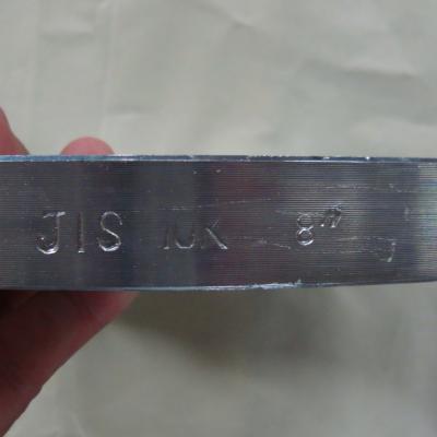 The first shows the flange's edge marked with "JIS K" (JIS standard) and size notation.