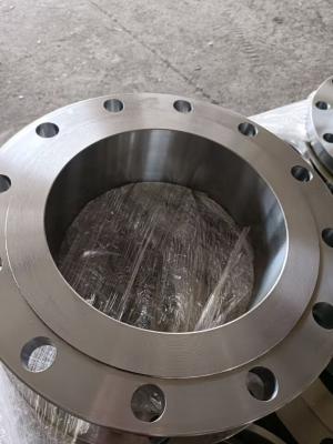 This image displays a metal threaded flat flange, featuring internal screw threads and evenly spaced mounting holes. Its surface has a fine machined texture, and the flange is wrapped in transparent protective film to keep it clean. It’s a hardware fitting designed for pipeline connection.