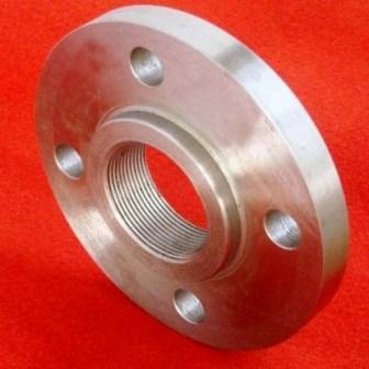 A metallic threaded flange (with internal screw threads) is shown against a red background. It features a smooth surface, evenly spaced bolt holes on the flat flange plate, and precise internal threading—suitable for quick, threaded pipeline connections.