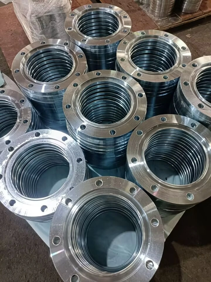 Made of stainless steel (valued for its corrosion resistance and durability), these flanges are commonly applied in medium-to-low pressure fluid systems (e.g., petroleum, chemical, or plumbing industries). The image shows them stacked in bulk and wrapped for protection, ready for supply in industrial piping installation projects.