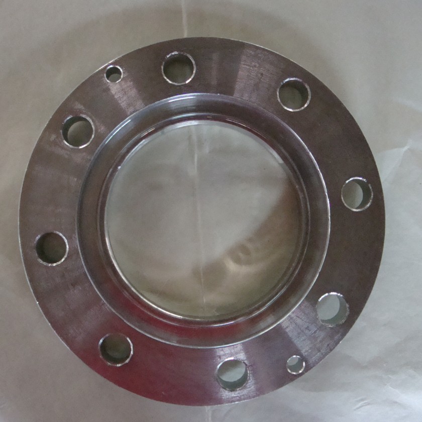 This is a stainless steel raised face plate flange — a circular industrial fitting with a raised sealing surface (RF) in the center and multiple evenly spaced bolt holes around the edge. Its smooth, metallic surface ensures tight sealing, ideal for medium-to-high pressure piping connections in industrial systems.
