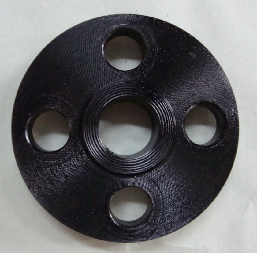 A black-coated threaded blind flange is shown, featuring a central internal-threaded bore (for sealing) and evenly spaced bolt holes. Its textured surface and compact design make it suitable for closing or sealing pipeline ends.