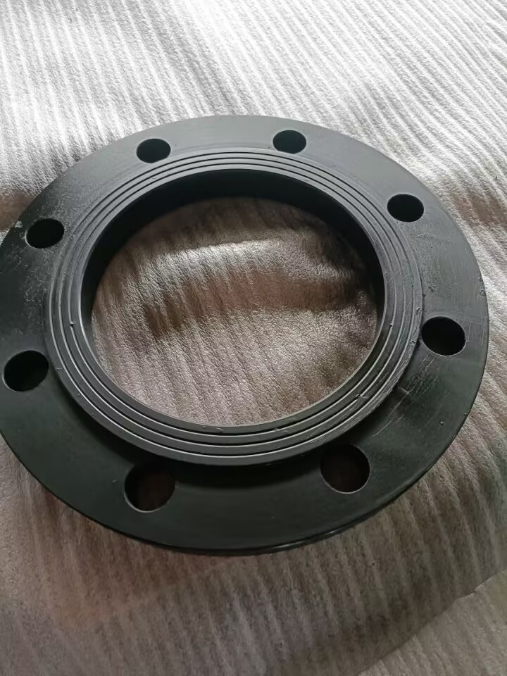 PE Flange - circular plastic fitting with bolt holes, smooth surface for pipe connection.